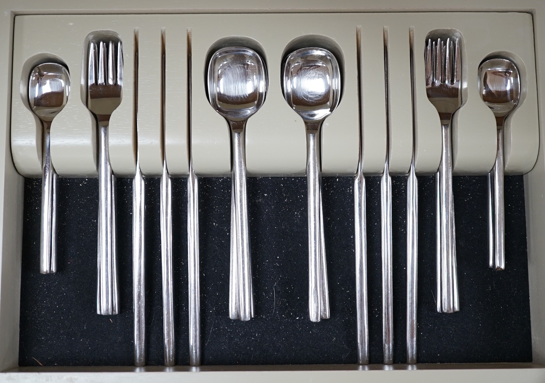 A contemporary 'Inspiration' stainless steel canteen of cutlery, 44cm wide. Condition - fair, not complete